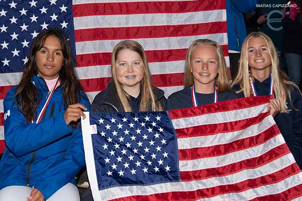 samara walshe poses with friends with the american flag