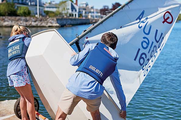 samara walshe gets her sailboat in the water with the help of some friends