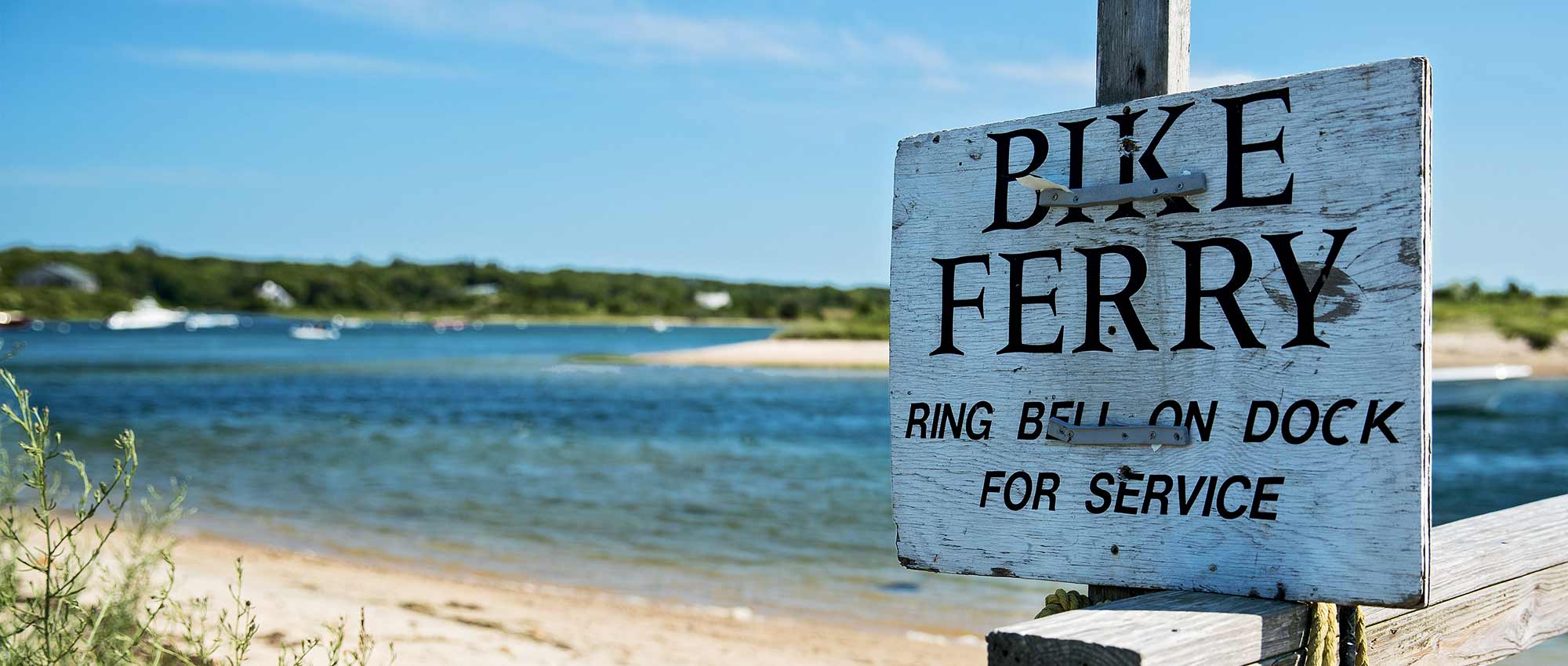 wooden sign on beach